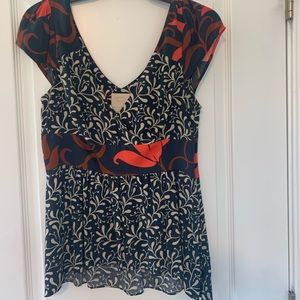 Orange and navy blouse.